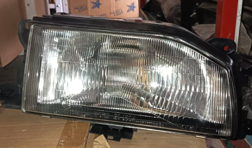 FAROLA MAZDA 323 DERECHA TYC