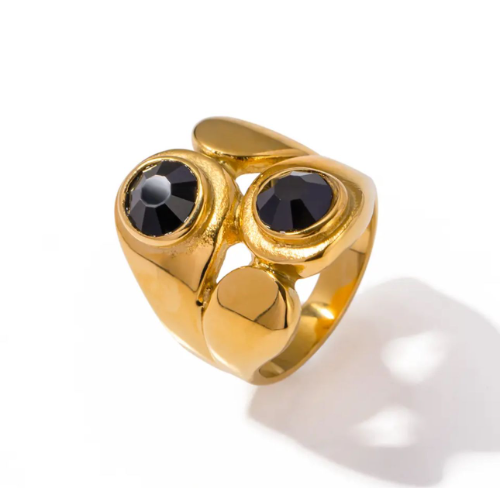 Anillo dorado ancho 2 piedras negras