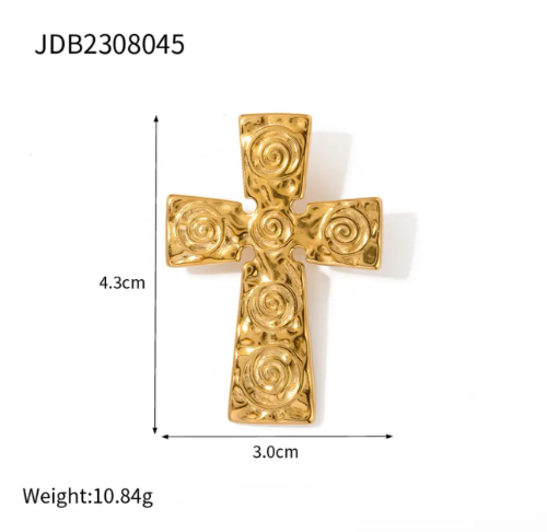 Broche dorado de cruz con espirales