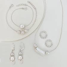 D1PULCERA PLATA Y ARETES